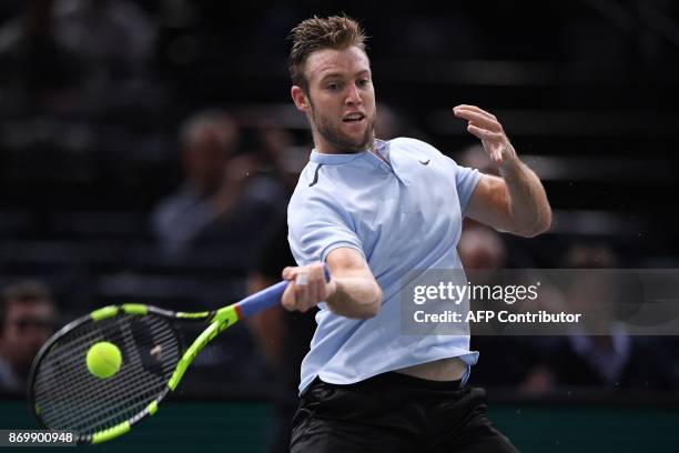 S Jack Sock returns the ball to Spain's Fernando Verdasco during the quarter-final round at the ATP World Tour Masters 1000 indoor tennis tournament...