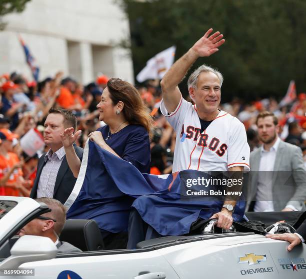 Texas Governor Greg Abbott and wife Cecilia Abbott wave to the crowd during the Houston Astros Victory Parade on November 3, 2017 in Houston, Texas....