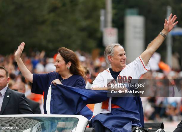 Texas Governor Greg Abbott and wife Cecilia Abbott wave to the crowd during the Houston Astros Victory Parade on November 3, 2017 in Houston, Texas....