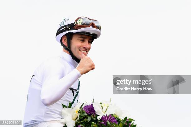 Jockey Flavien Prat celebrates after riding Battle Of Midway to a win in the Las Vegas Breeder's Cup Dirt Mile on day one of the 2017 Breeder's Cup...