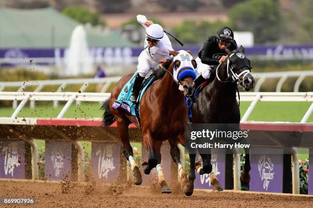 Battle Of Midway ridden by jockey Flavien Prat defeats Sharp Azteca ridden by jockey Paco Lopez to win the Las Vegas Breeder's Cup Dirt Mileon day...