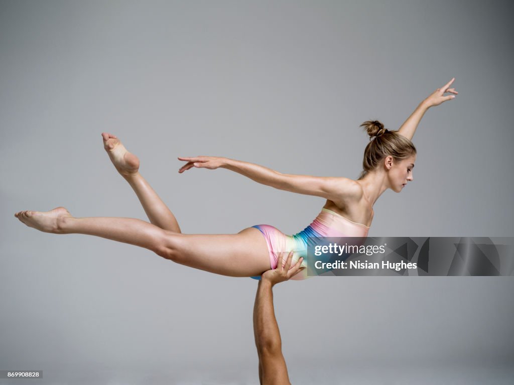 Modern Dancer being lifted while dancing in studio