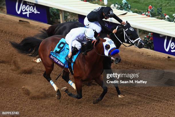 Battle Of Midway ridden by jockey Flavien Prat defeats Sharp Azteca ridden by jockey Paco Lopez to win the Las Vegas Breeder's Cup Dirt Mile on day...