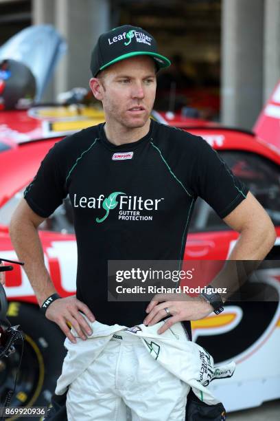 Blake Koch, driver of the LeafFilter Gutter Protection Chevrolet, stands in the garage area during practice for the NASCAR XFINITY Series O'Reilly...