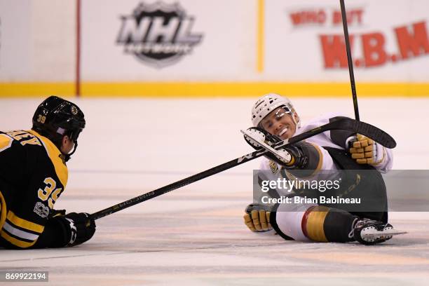 Matt Beleskey of the Boston Bruins gets his stick stuck in the skate of Jonathan Marchessault the Vegas Golden Knights at the TD Garden on November...