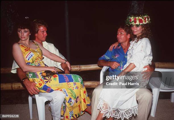 April 13: Morgan Brittany, John Denver and Australian actress Cassandra Delaney who he married in 1988 rest at the end of a day filming ' Bob Hopes...