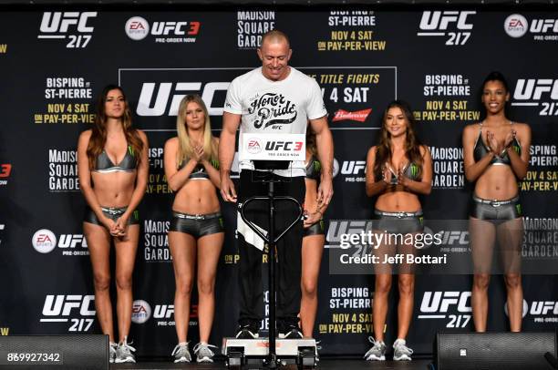 Georges St-Pierre of Canada poses on the scale during the UFC 217 weigh-in inside Madison Square Garden on November 3, 2017 in New York City.