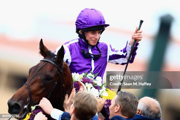 Jockey Ryan Moore celebrates after riding Mendelssohn to a win in the Breeder's Cup Juvenile Turf on day one of the 2017 Breeder's Cup World...