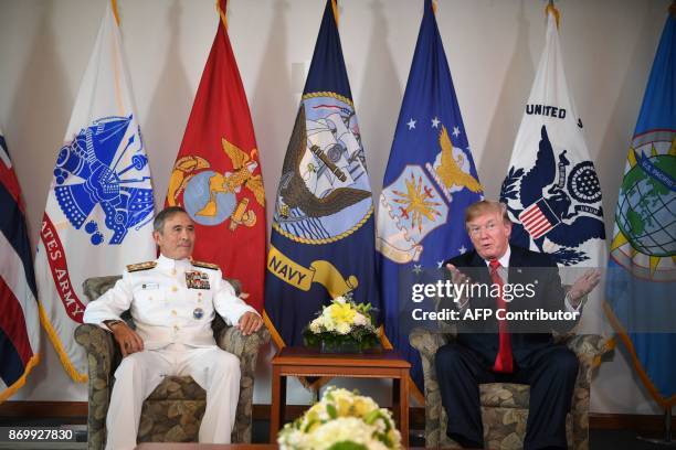 President Donald Trump meets with Admiral Harry B. Harris, Jr., Commander, US Pacific Command, in Aiea, Hawaii, on November 3, 2017. / AFP PHOTO /...