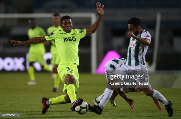 Aves forward Derley from Brazil with Vitoria Setubal midfielder Joao Costinha from Portugal in action during the Primeira Liga match between Vitoria...