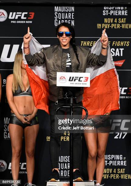 Joanna Jedrzejczyk of Poland poses on the scale during the UFC 217 weigh-in inside Madison Square Garden on November 3, 2017 in New York City.