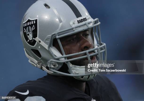 Clive Walford of the Oakland Raiders warms up before the start of NFL game action against the Buffalo Bills at New Era Field on October 29, 2017 in...