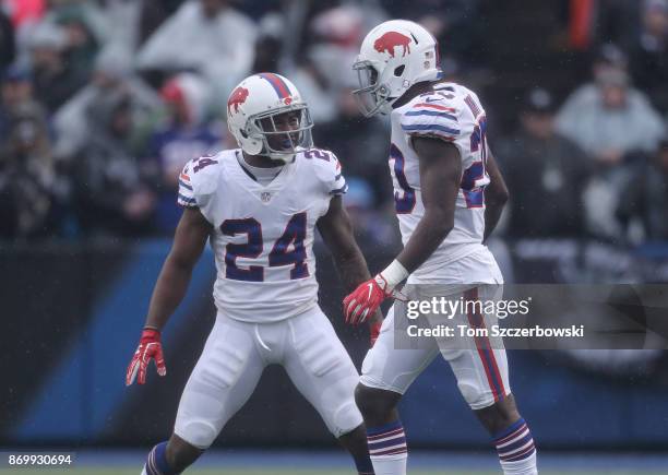 Leonard Johnson of the Buffalo Bills celebrates with Shareece Wright during NFL game action against the Oakland Raiders at New Era Field on October...