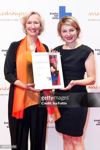 Katrin Weidemann and German presenter Sabine Heinrich attend the 19th Media Award by Kindernothilfe on November 3, 2017 in Berlin, Germany.