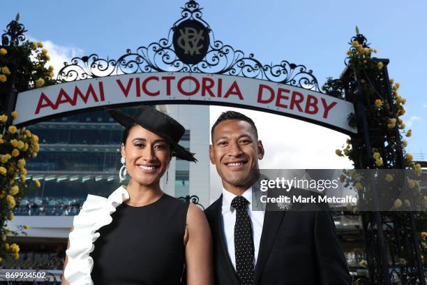 Maria Tutaia and Israel Folau pose on AAMI Victoria Derby Day at Flemington Racecourse on November 4, 2017 in Melbourne, Australia.