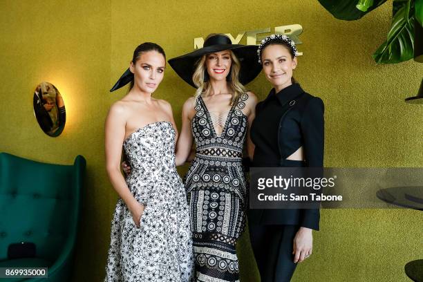 Jodi Gordon, Jennifer Hawkins and Rachael Finch pose at the Myer Marquee on Derby Day at Flemington Racecourse on November 4, 2017 in Melbourne,...