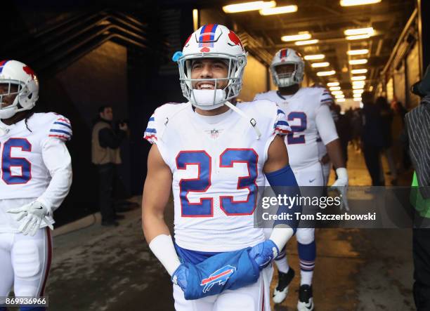 Micah Hyde of the Buffalo Bills and teammates walk out through the tunnel onto the field before the start of NFL game action against the Oakland...