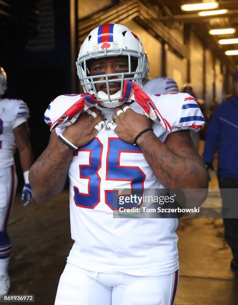 Mike Tolbert of the Buffalo Bills walks through the tunnel onto the field before the start of their NFL game against the Oakland Raiders at New Era...