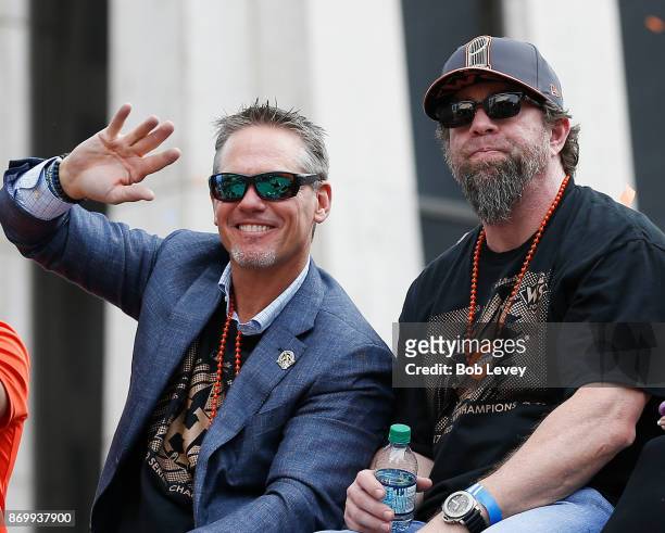 Former Houston Astros and Hall of Famers Craig Biggio and Jeff Bagwell wave to the crowd during the Houston Astros Victory Parade on November 3, 2017...