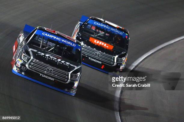 Ben Rhodes, driver of the Safelite Auto Glass Toyota, leads Christopher Bell, driver of the JBL Toyota, during the NASCAR Camping World Truck Series...