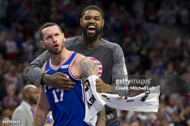 Redick of the Philadelphia 76ers celebrates with Amir Johnson after a made three point basket against the Indiana Pacers in the fourth quarter at the...