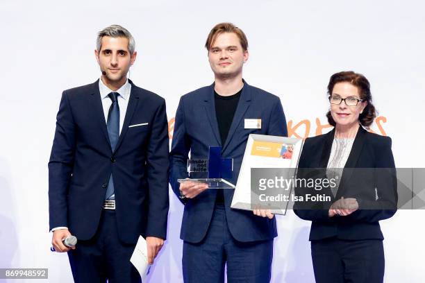 German-Iranian presenter Michel Abdollahi, award winner Bjoern Stephan and German actress Gudrun Landgrebe during the 19th Media Award by...