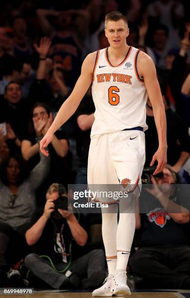 Kristaps Porzingis of the New York Knicks reacts after a dunk in the fourth quarter against the Phoenix Suns at Madison Square Garden on November 3,...