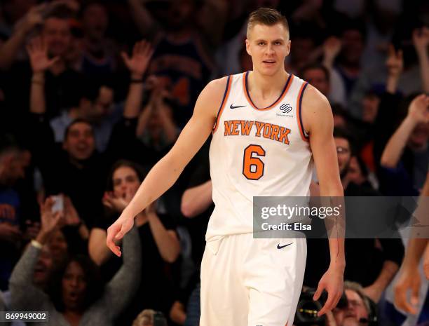 Kristaps Porzingis of the New York Knicks reacts after a dunk in the fourth quarter against the Phoenix Suns at Madison Square Garden on November 3,...