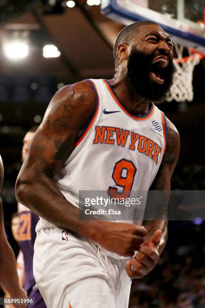 Kyle O'Quinn of the New York Knicks celebrates after he drew the foul in the second half against the Phoenix Suns at Madison Square Garden on...