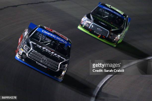 Ben Rhodes, driver of the Safelite Auto Glass Toyota, races during the NASCAR Camping World Truck Series JAG Metals 350 Driving Hurricane Harvey...