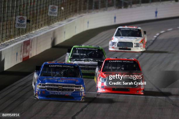 Stewart Friesen, driver of the Halmar International Chevrolet, leads Regan Smith, driver of the BTS Tire & Wheel/Advance Auto Parts Ford, during the...