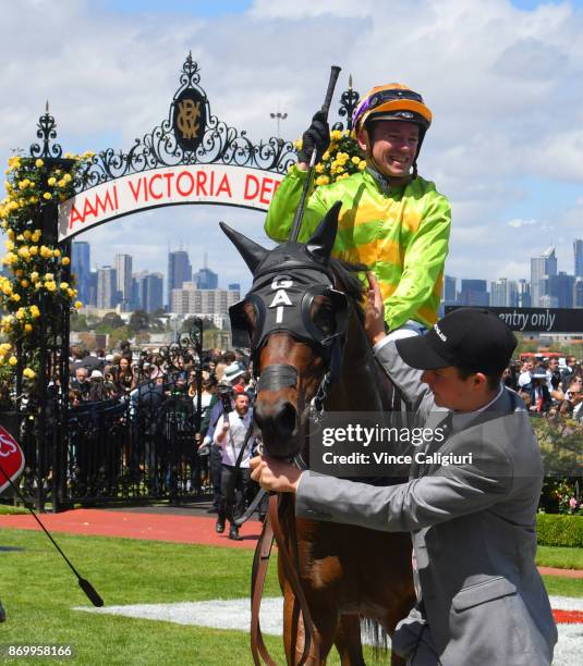 Stephen Baster riding Cismontane after winning Race 4, Lexus Stakes on Derby Day at Flemington Racecourse on November 4, 2017 in Melbourne, Australia.