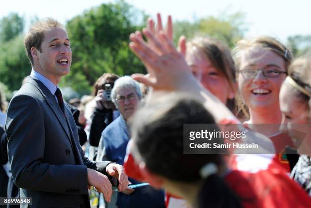 Prince William, President of The Football Association meets members of the public as he visits Kingshurst Sporting FC on May 11, 2009 in Kingshurst,...
