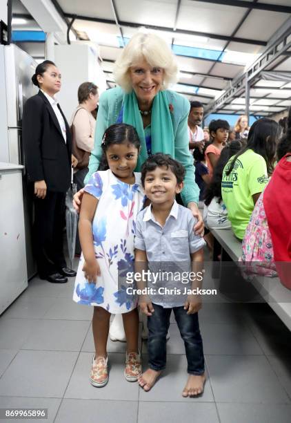 Arianna Lewis presented Camilla, Duchess of Cornwall a bracelet at The Lost Food Project and Lighthouse Children's Welfare Centre during her visit on...
