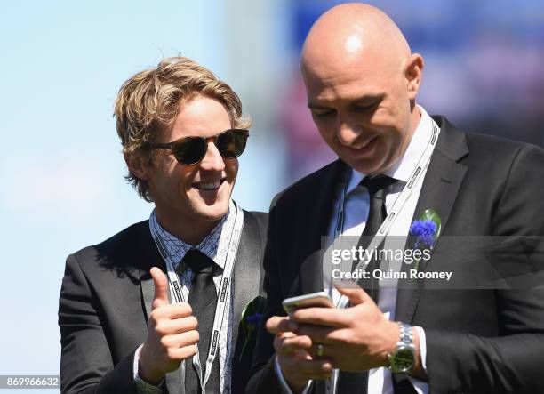 Rory Sloane and James Podsiadly celebrate Merchant Navy winning the Coolmore Stud Stakes on Derby Day at Flemington Racecourse on November 4, 2017 in...