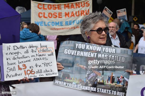 Protesters hold a rally in Sydney to urge the Australian government to end the refugee crisis on Manus Island on November 4, 2017. The United Nations...