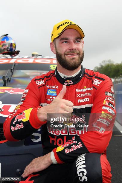 Shane Van Gisbergen driver of the Red Bull Holden Racing Team Holden Commodore VF celebrates after winning race 23 for the Auckland SuperSprint,...