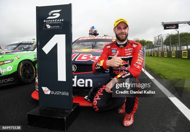 Shane Van Gisbergen driver of the Red Bull Holden Racing Team Holden Commodore VF celebrates after winning race 23 for the Auckland SuperSprint,...