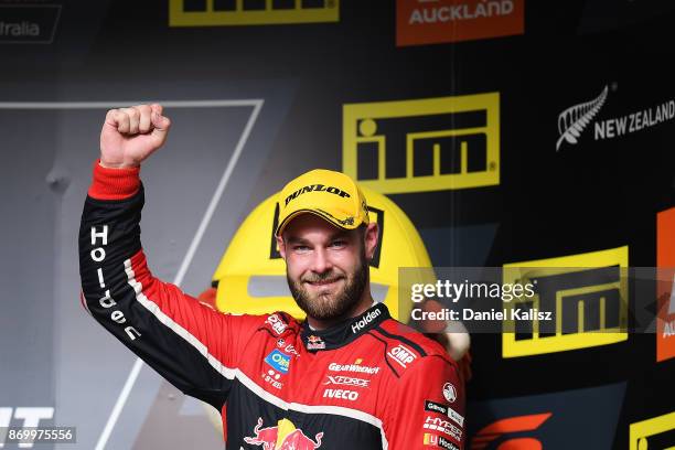 Shane Van Gisbergen driver of the Red Bull Holden Racing Team Holden Commodore VF celebrates after winning race 23 for the Auckland SuperSprint,...