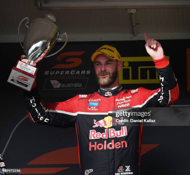 Shane Van Gisbergen driver of the Red Bull Holden Racing Team Holden Commodore VF celebrates after winning race 23 for the Auckland SuperSprint,...