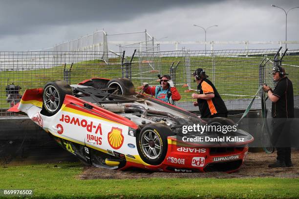 The car of Fabian Coulthard driver of the Shell V-Power Racing Team Ford Falcon FGX is pictured after colliding with David Reynolds driver of the...