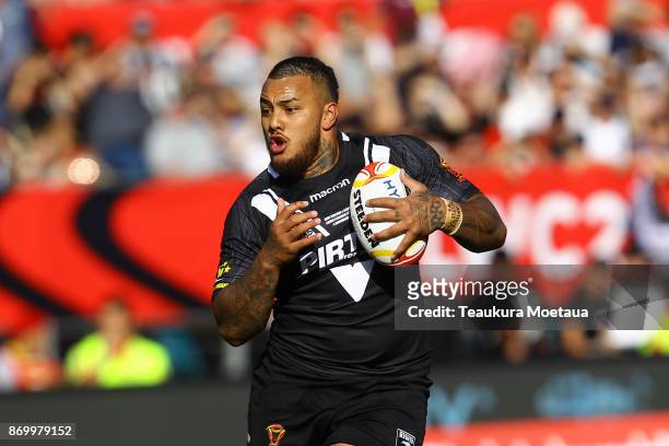 Addin Fonua-Blake of New Zealand is tackled during the 2017 Rugby League World Cup match between the New Zealand Kiwis and Scotland at AMI Stadium on...