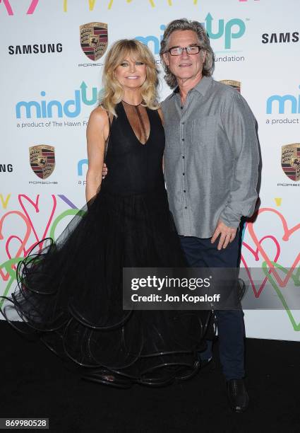 Goldie Hawn and Kurt Russell arrive at Goldie's Love In For Kids at Ron Burkle's Green Acres Estate on November 3, 2017 in Beverly Hills, California.