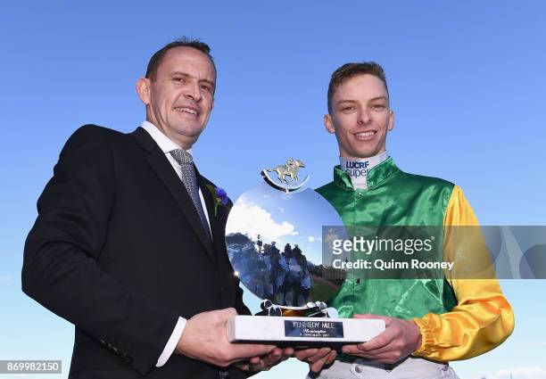 Trainer Chris Waller and jockey Michael Dee who rode Shillelagh pose with the trophy after winning race 8, the Kennedy Mile on Derby Day at...