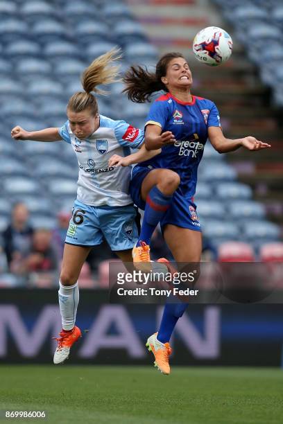 Katherine Stengel of the Jets and Emily Sonnett of Sydney FC contest the ball during the round two W-League match between the Newcastle Jets and...