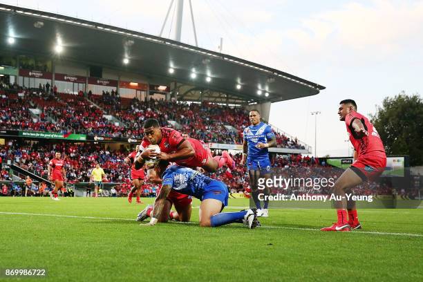 Michael Jennings of Tonga scores a try during the 2017 Rugby League World Cup match between Samoa and Tonga at Waikato Stadium on November 4, 2017 in...