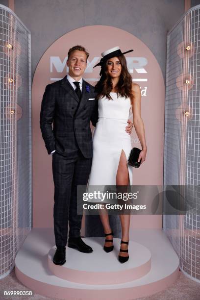 Myer Fashions on the Field Ambassadors Rebecca Harding and Dalton Graham pose at The Park on AAMI Victoria Derby Day at Flemington Racecourse on...