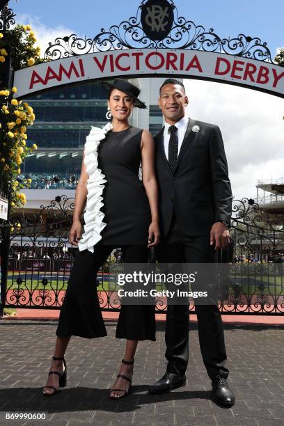 Maria Tutaia and Israel Folau pose on AAMI Victoria Derby Day at Flemington Racecourse on November 4, 2017 in Melbourne, Australia.