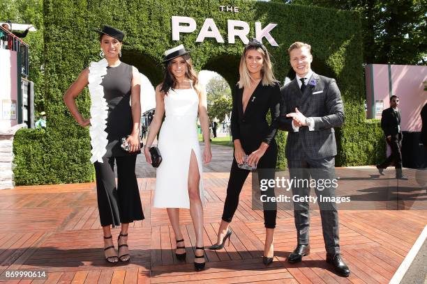 Maria Tutaia, Rebecca Harding, Georgia Connolly and Dalton Graham pose at The Park on AAMI Victoria Derby Day at Flemington Racecourse on November 4,...