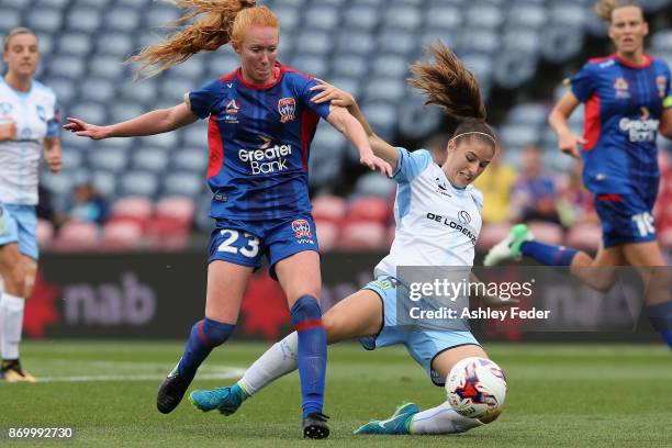 Tori Huster of the Jets contests the ball against Amy Harrison of Sydney FC during the round two W-League match between the Newcastle Jets and Sydney...